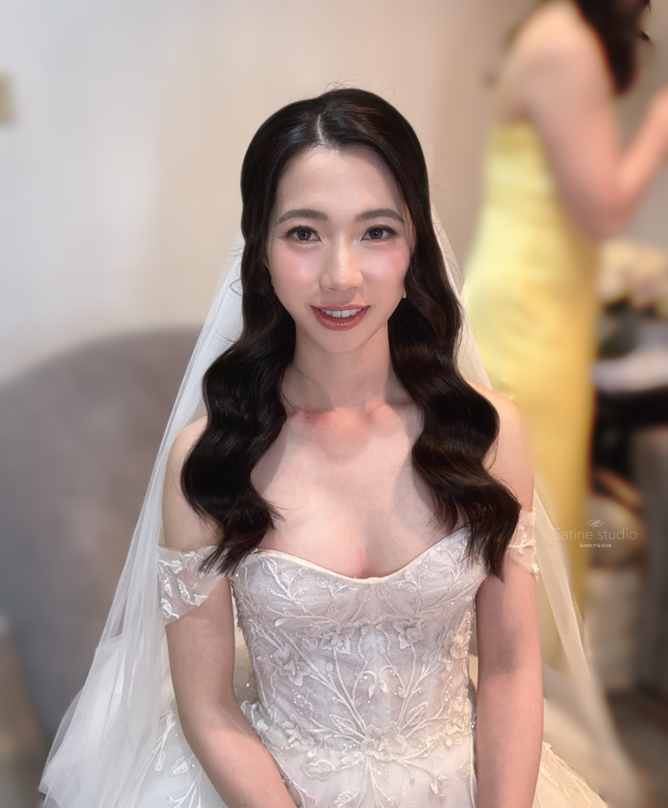 close-up of Asian bridal makeup with loose wave hairstyle in Toronto by Satine Yang